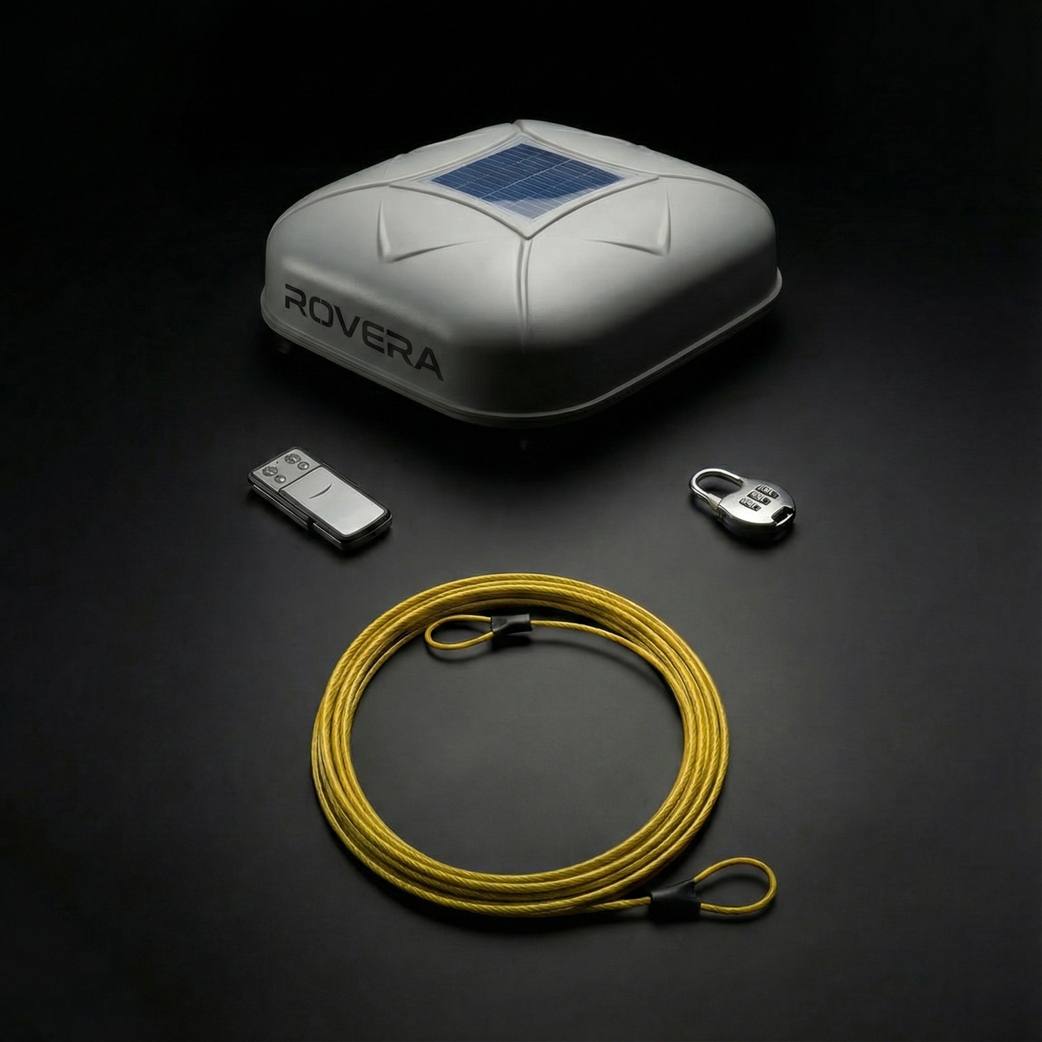 ROVERA roof box with solar panel, remote control, and yellow rope on a dark background